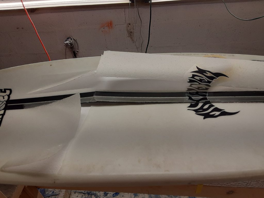 Buckled surfboard ding repair